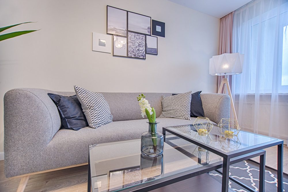 floor lamp beside sofa and window 1571471